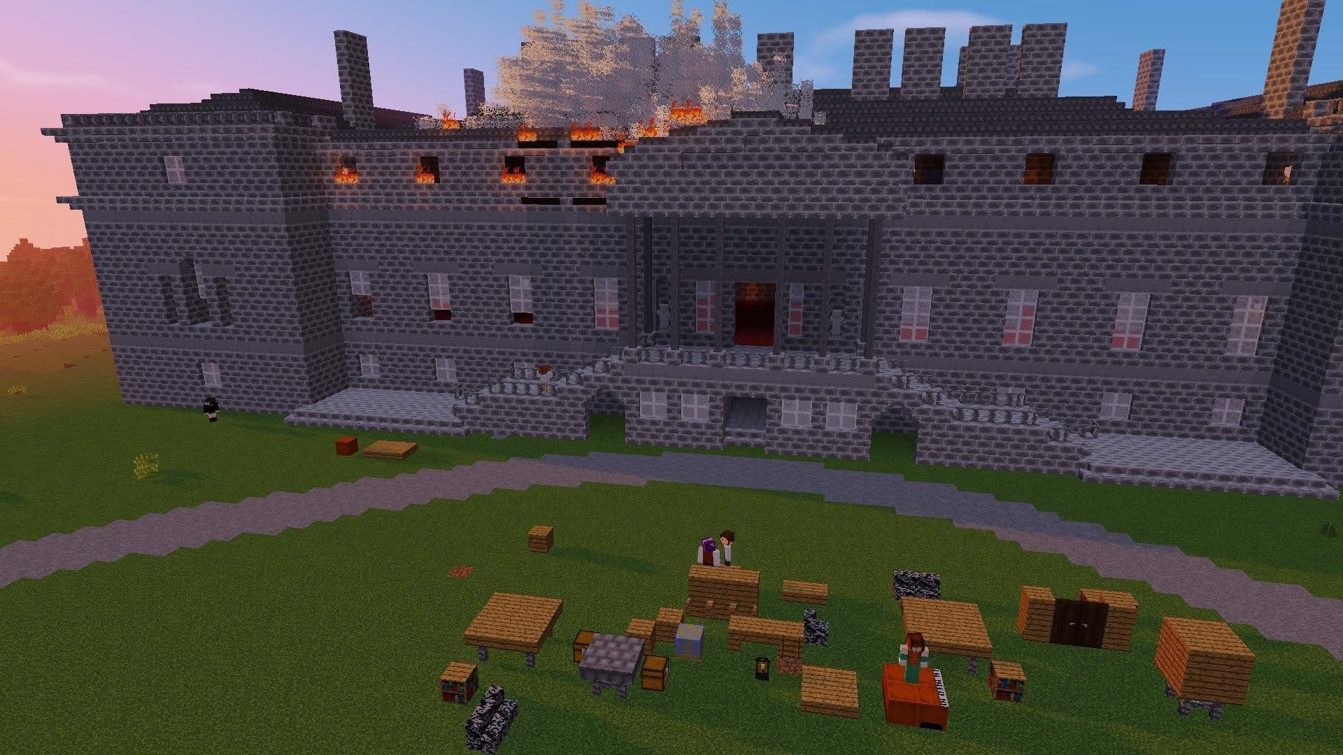 The rebuilt Penicuik House in Minecraft, engulfed in fire depicting the 1899 blaze, with the great lawn in the foreground.